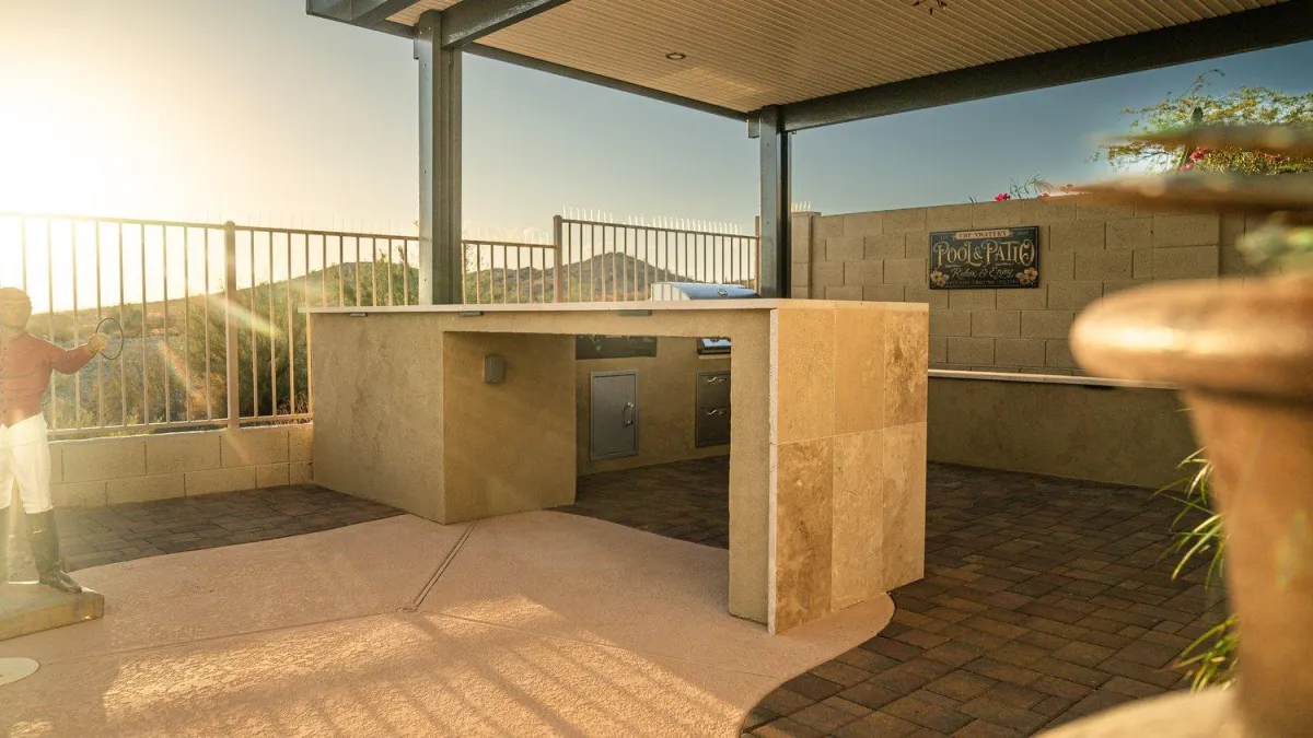 Custom outdoor kitchen with mountain views at sunset