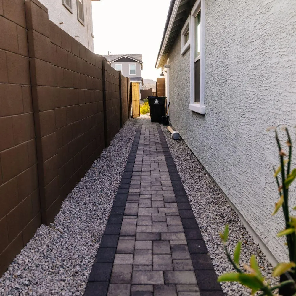 Side yard paver walkway with charcoal border