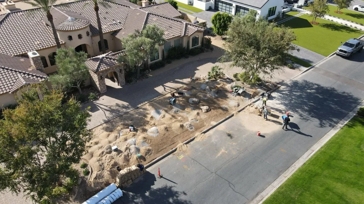Aerial view of front yard hardscape build in progress