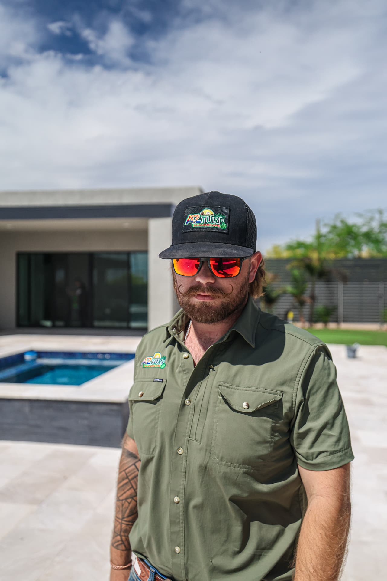 AZ Turf and Landscape owner at a completed pool and landscape project