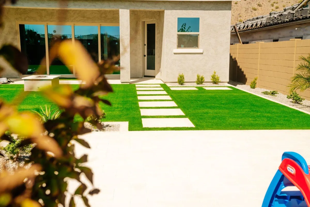 Modern turf yard with paver stepping stones