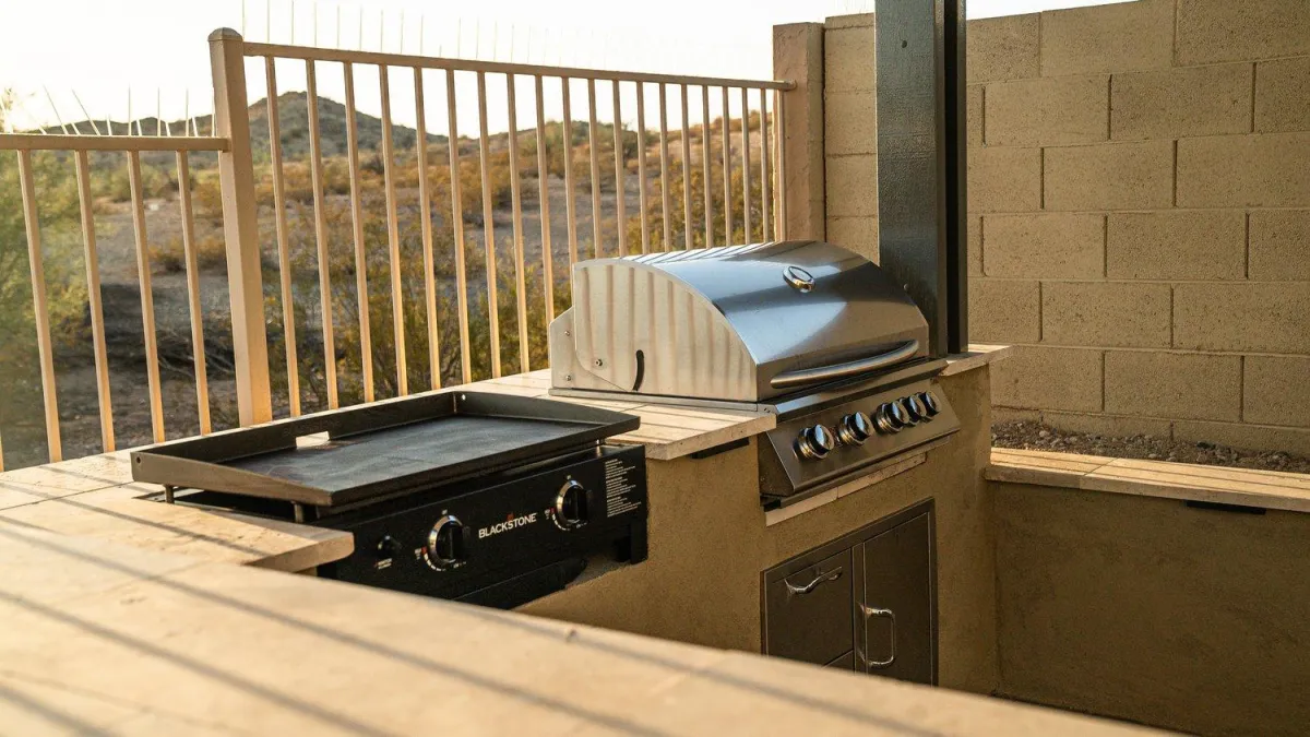 Built-in outdoor grill and griddle with desert view