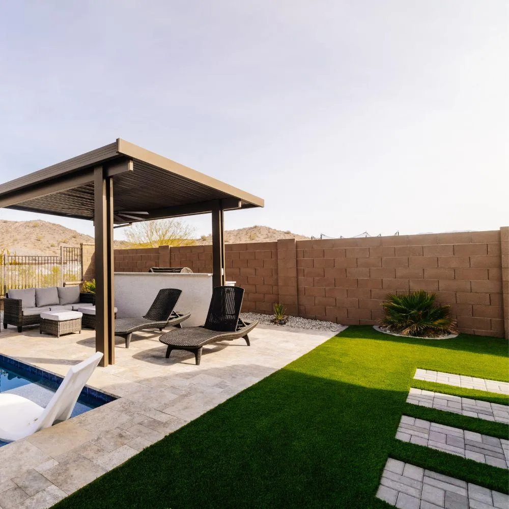 Pergola lounge with turf and paver stepping stones
