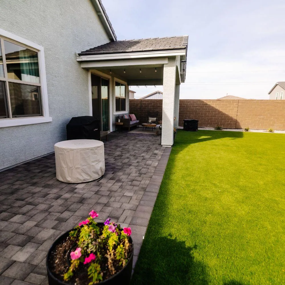 Paver patio and turf lawn with covered patio