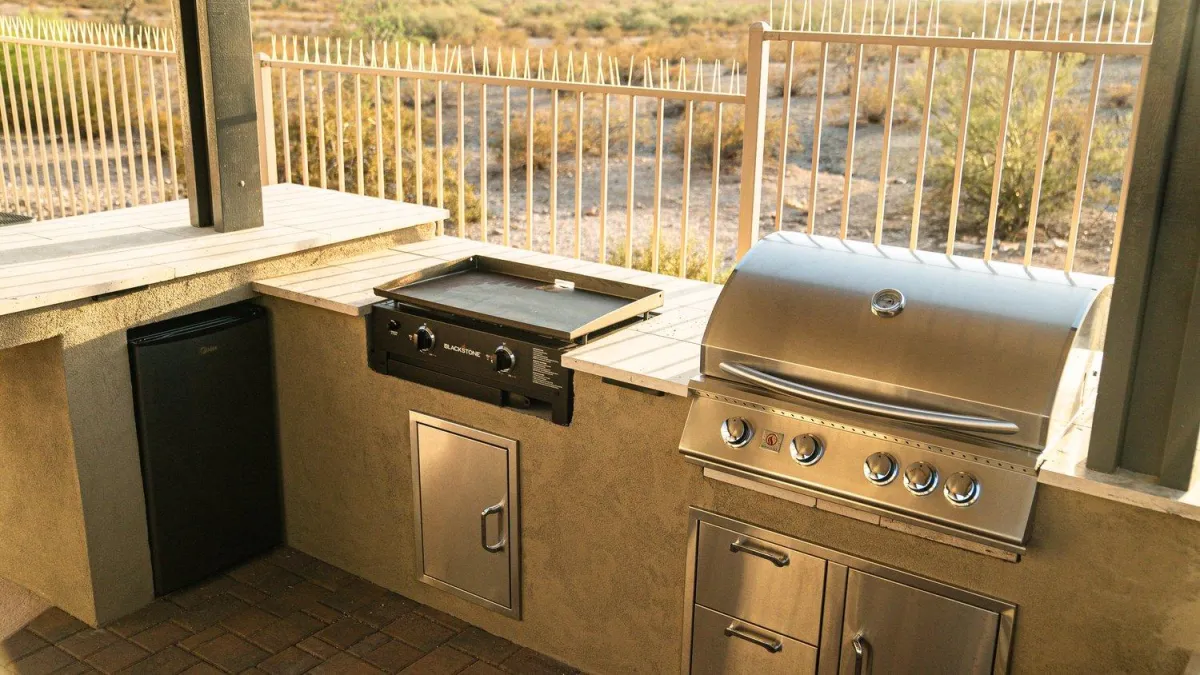 Built-in grill and griddle station with desert backdrop