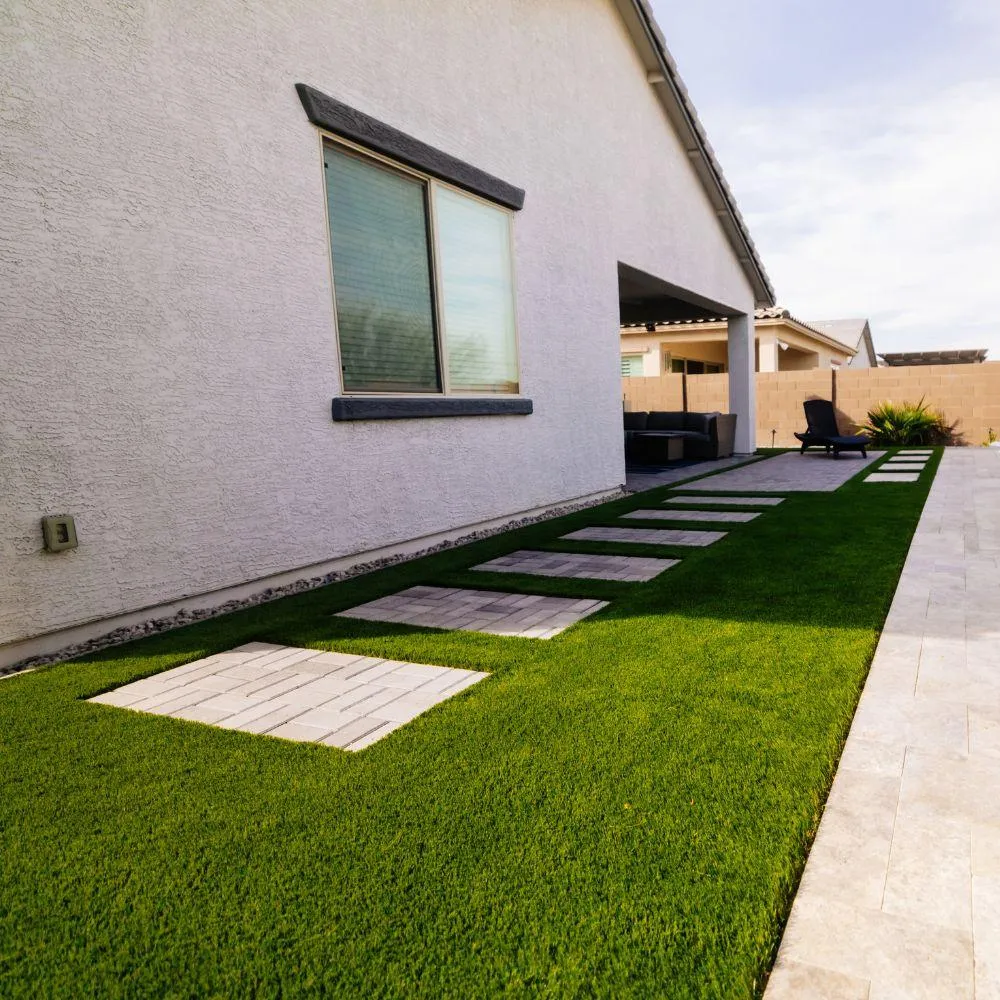 Side yard turf strip with paver stepping stones along home